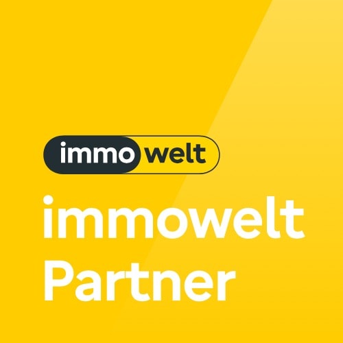 Logo von „immowelt Partner“ auf gelbem Grund.